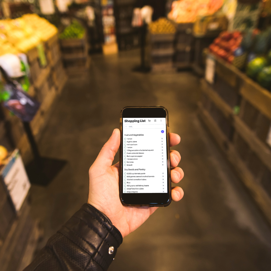 A smartphone displaying a neatly organized digital shopping list, emphasizing ease of sharing and collaboration.